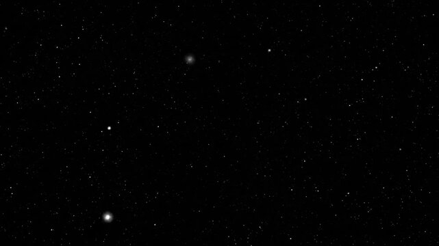 Vast, dark expanse filled with countless white pinpricks of light, suggesting a starfield