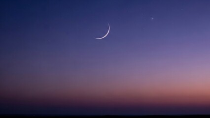A crescent moon and bright star glisten above a dusky horizon sprinkled with dim stars in a purple sky