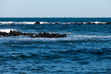 Fototapeta premium idyllic seascape with rocks and waves at Biyangdo in Udo, Jeju Island, South Korea