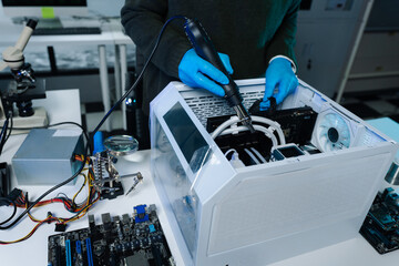 Hands repairing electronic devices. Electronic technician.