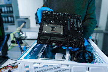 Hands repairing electronic devices. Electronic technician.