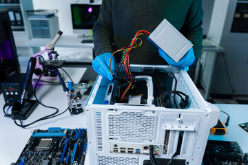 Hands repairing electronic devices. Electronic technician.