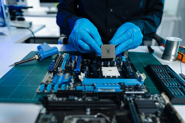 Hands repairing electronic devices. Electronic technician.