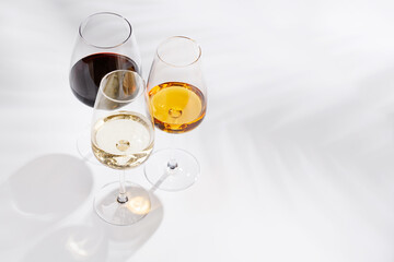 Obraz premium Different wine glasses on white background