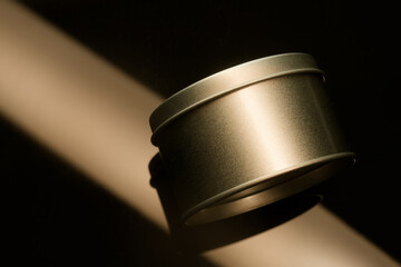 Abstract geometric composition with golden metallic cylinder and ray of light. High resolution...