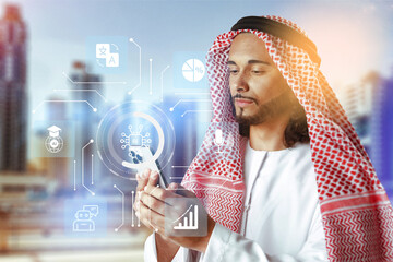 Young man checks smartphone in city with digital technology symbols around him