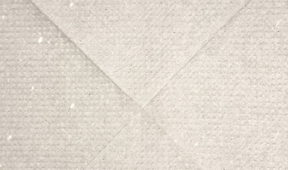 Fototapeta premium Dotted beige halftone background. Light cream pixelated paper texture. Retro craft taupe wallpaper. Grunge grainy gradient overlay. Weathered dirty canvas material backdrop.