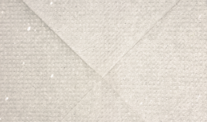 Dotted beige halftone background. Light cream pixelated paper texture. Retro craft taupe wallpaper. Grunge grainy gradient overlay. Weathered dirty canvas material backdrop.