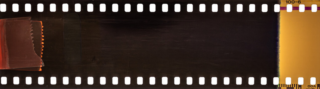 Vintage 35mm film strip border with sprocket holes and light leak texture