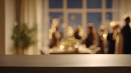 A blurred view of a festive gathering, highlighting a beautifully set table and people mingling in a warm, cozy atmosphere.