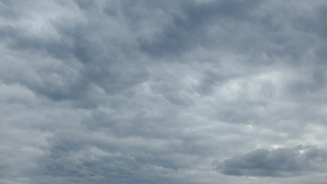 The sky appears overcast with dynamic cloud patterns creating an intriguing atmosphere