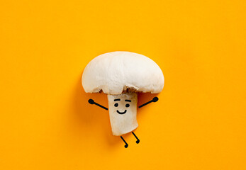 Mushroom character smiling on bright orange background