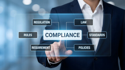 Professional businessman touching digital screen displaying compliance related terms in a 