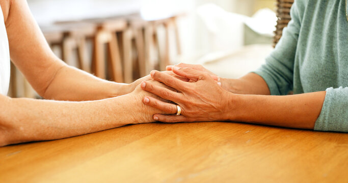 Holding hands, house and women with support, friends and comfort with empathy, grief and compassion. Closeup, apartment and people with sympathy, care and mourning for loss, trust and consoling
