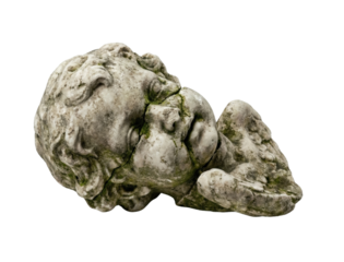 Broken stone cherub head statue with moss isolated. Ancient sculpture ruin.