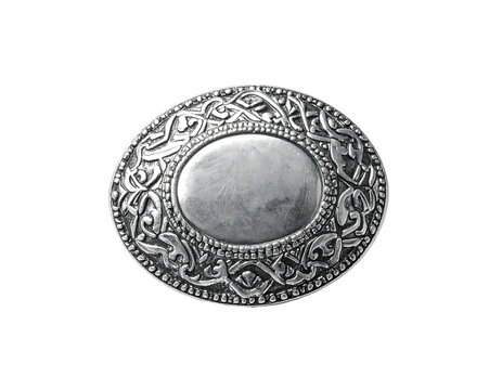 Ornate, circular silver brooch with an oval center and intricate Celtic knotwork design
