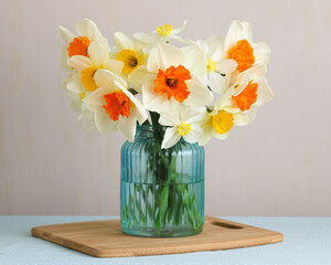 Daffodil flowers blooming in glass vase