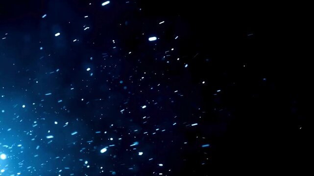 Sparkling blue particles on dark background create dynamic visual effect