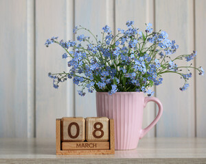 Blue forget-me-not flowers celebrating international women day, 8 march