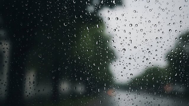 Raindrops on Window Pane in Dark Room Interior View