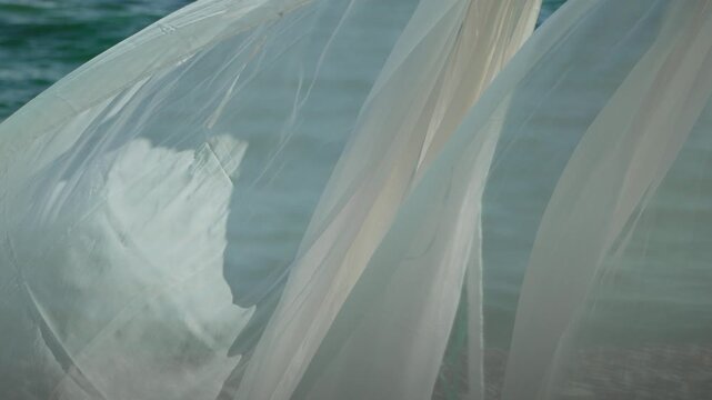 Bungalows sea. Beach Lounge bed with white silky curtains. Lounge bed with canopy at seaside. Beach Chairs and Sunshades. Summer Vacation resort concept.