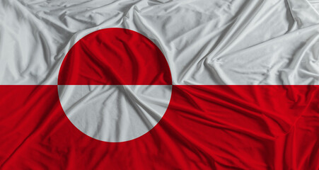 Greenland flag with fabric texture background. National flag of Greenland with cloth texture © IHERPHOTO