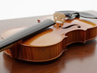 Obraz premium Closeup of a violin resting on a wooden surface with elegant curves and polished finish