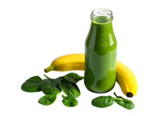 Vibrant green smoothie in a glass bottle with bananas and spinach leaves