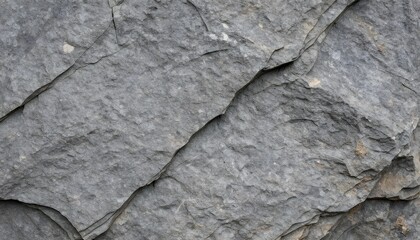 Obraz premium Close-up texture of weathered grey stone with natural cracks and rough surfaces