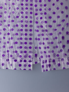 Close-Up of Violet Polka-Dot Waterproof Poncho Edge