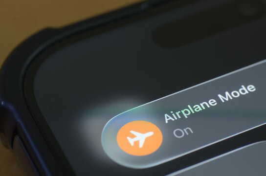 Mobile Phone Display with Airplane Mode On Highlighting Offline Status and Travel Technology