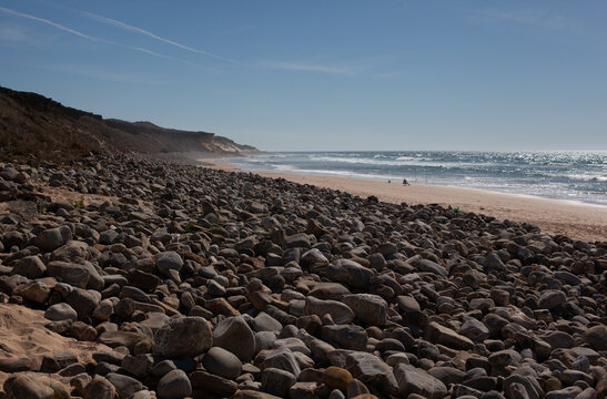 Man fishing at Malhão Beach in Portugal