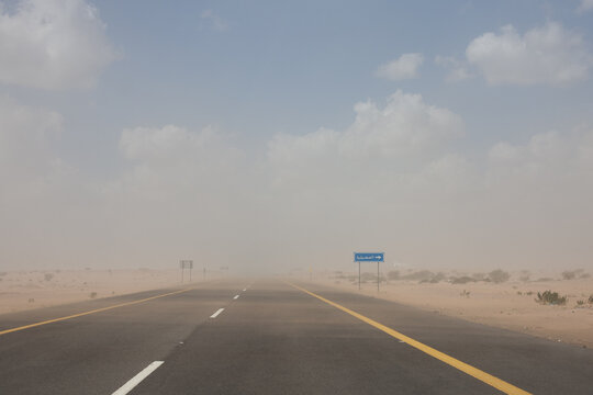 Sandstorm blowing across a highway in Saudi Arabia