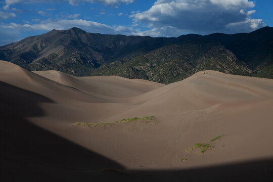 Couple hiking on the sand dunes at Great Sand Dunes National Park