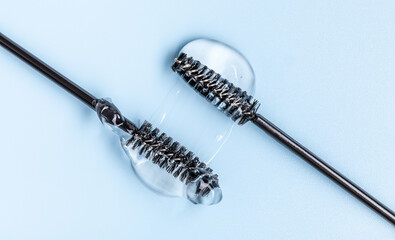 transparent eyelash eyebrow gel serum, smooth and shiny texture stroke, blue background