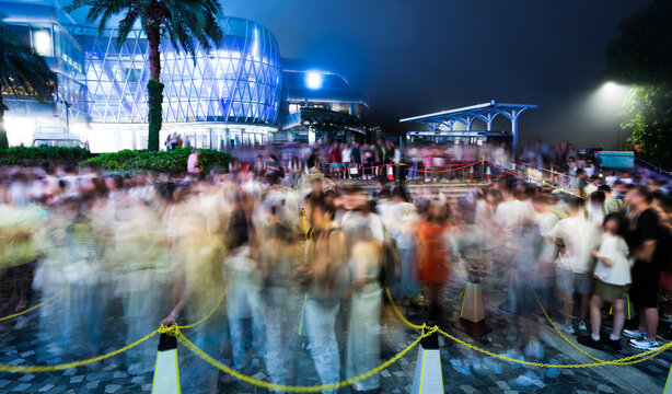Blur of crowd people queuing up and waiting