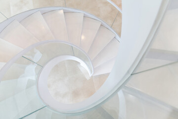 Beautiful white spiral staircase in the building