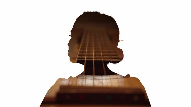 Double exposure of woman silhouette with guitar strings &ndash; music and emotion concept