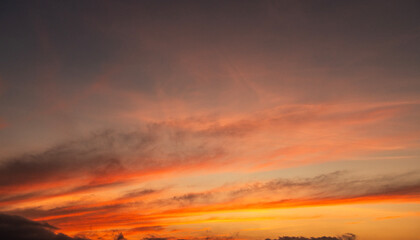 Beautiful bright orange sunset sky with clouds.