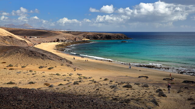 Caleta del Congrio beach, located close to Papagayo beach in Los Ajaches National Park in Lanzarote, Canary Islands, Spain, a sandy beach surrounded by a volcanic and rocky coastal landscape