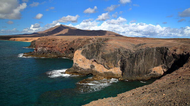 The wild, rocky and volcanic coast around Papagayo beach, located near the sea resort Playa Blanca, Lanzarote, Canary Islands, Spain