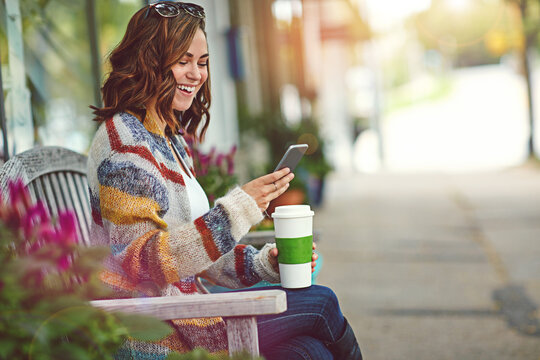 Coffee, happy and woman on bench with phone, post reaction and communication on chat site. Space, technology and female person in town with cup, app update and online message on social media.