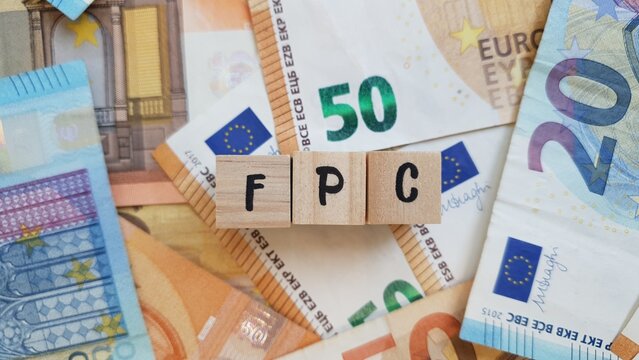 FPC acronym made of wooden letter cubes on pile of Euro banknotes. Fundo de Pensoes de Carreira (Career Pension Fund)
