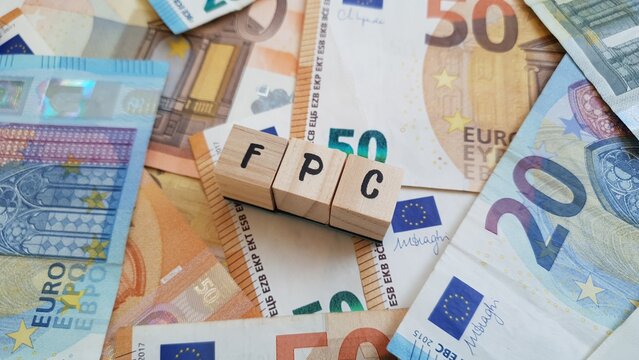 FPC acronym made of wooden letter cubes on pile of Euro banknotes. Fundo de Pensoes de Carreira (Career Pension Fund)