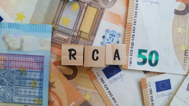 RCA acronym made of wooden letter cubes on pile of Euro banknotes. Responsabilidade Civil Autom&oacute;vel (Automobile Civil Liability Insurance)