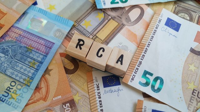RCA acronym made of wooden letter cubes on pile of Euro banknotes. Responsabilidade Civil Autom&oacute;vel (Automobile Civil Liability Insurance)