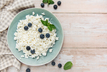 Cottage cheese with fresh blueberries and mint for breakfast
