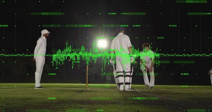 Bowler running and bowling for cricket match on lit pitch batter guarding as waveform moving