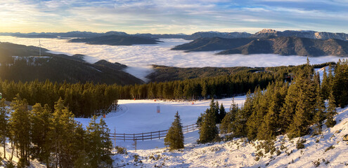 Stuhleck ski resort slope white winter landscape. Mountain slope at sunset in Styria, Austrian Alp