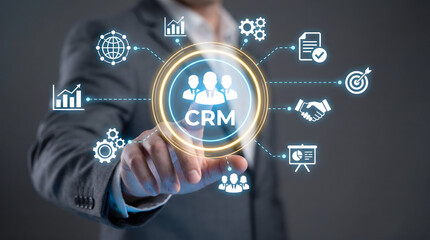 Business professional interacting with a glowing CRM customer relationship management syst